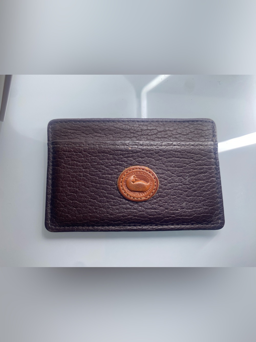 Dooney & Bourke Dark Brown Leather Card Holder with Tan Logo Patch